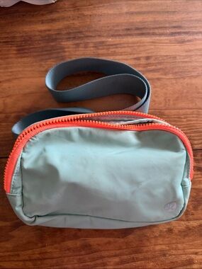 lululemon athletica sea foam Green Belt Bag with Orange accents